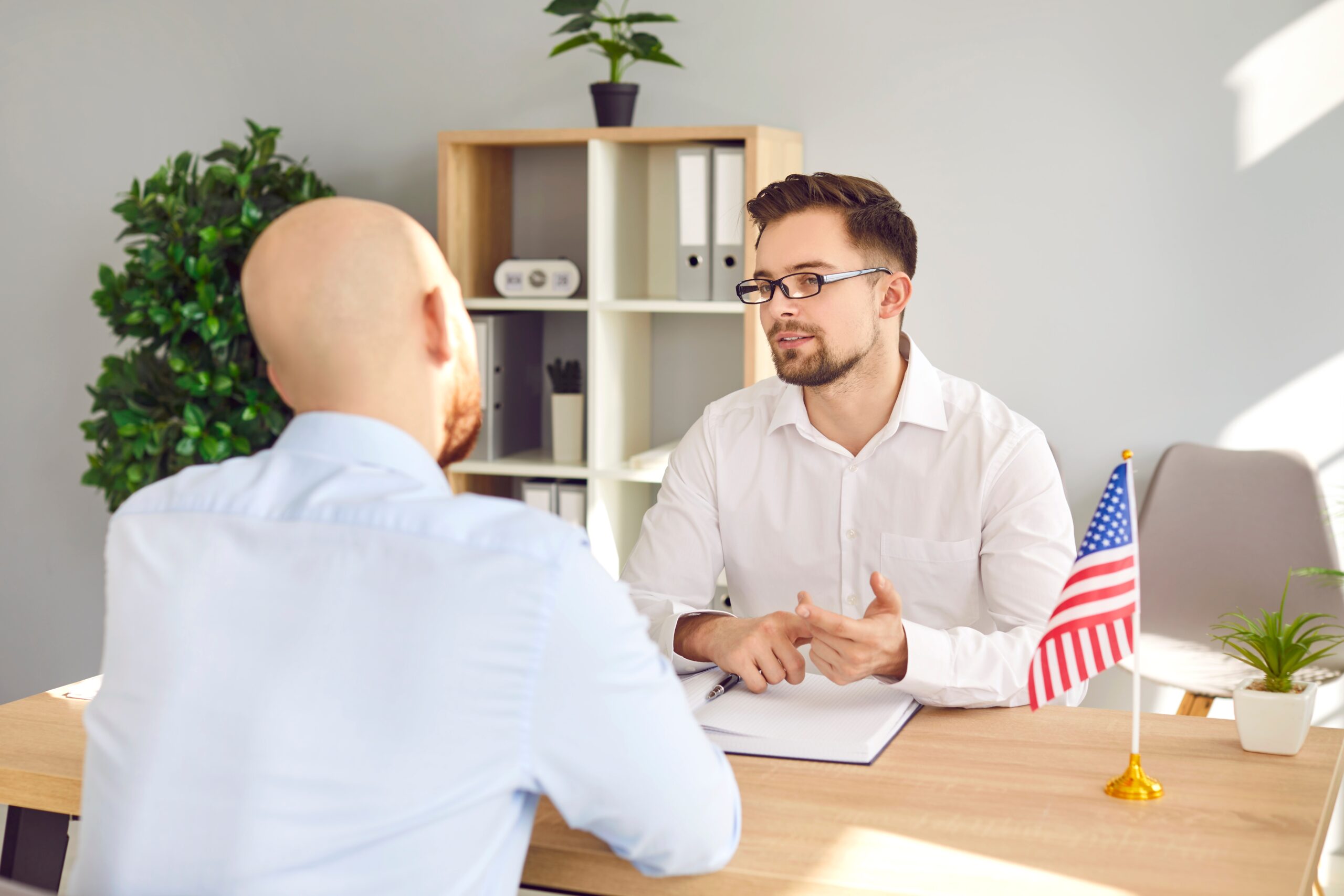 Image 1lead attorney speaking directly to Houston green card applicants