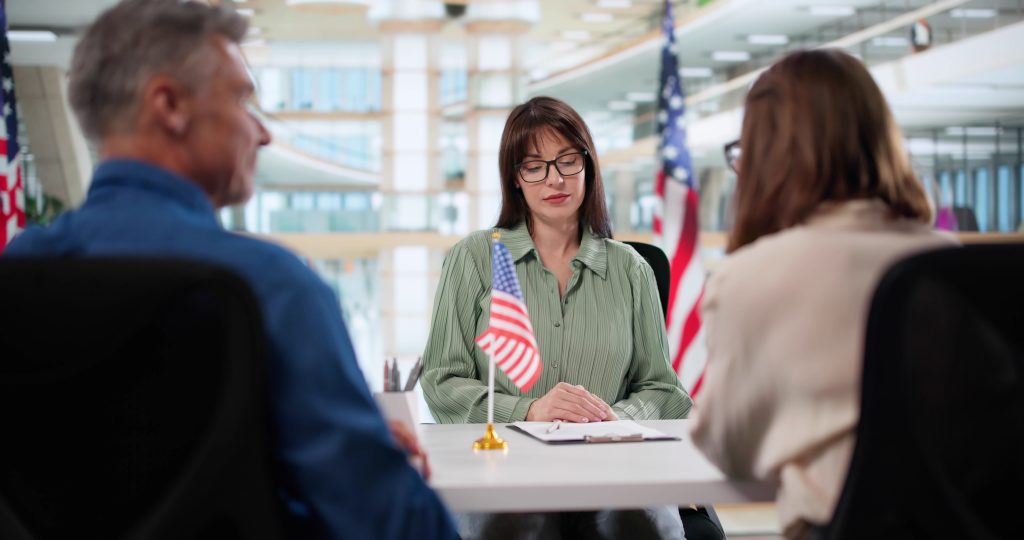 Immigrant husband & wife consulting with an immigration lawyer in houston