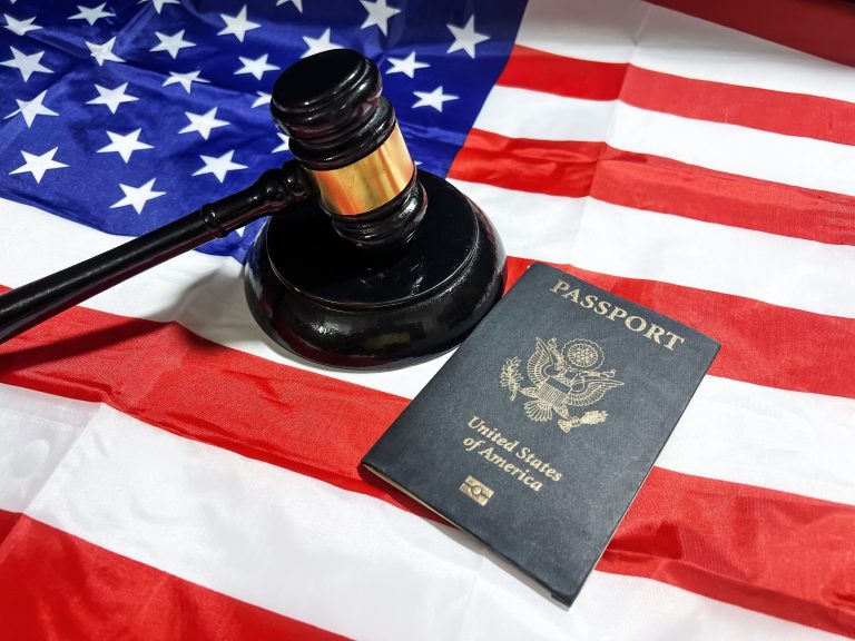 U.S. Passport with Supreme court gavel and American flag in the backdrop. Court decision regarding us nationality, citizenship