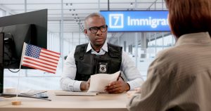 Immigration Officer checking a womans passport at the airport