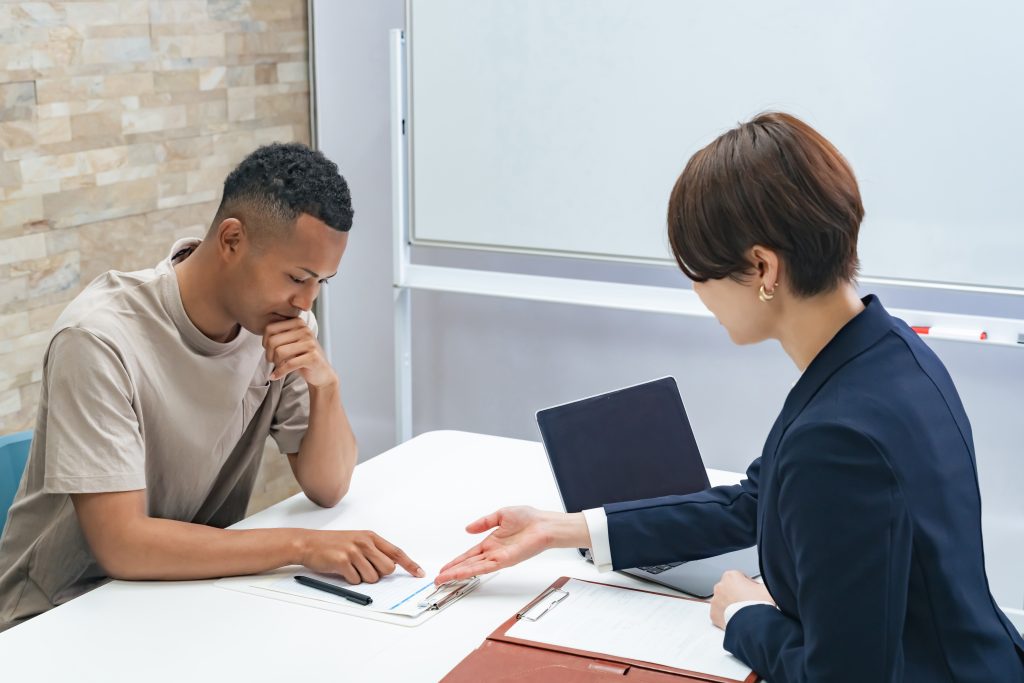 A,Black,Man,And,A,Japanese,Female,Staff,Member,Having- Immigration law