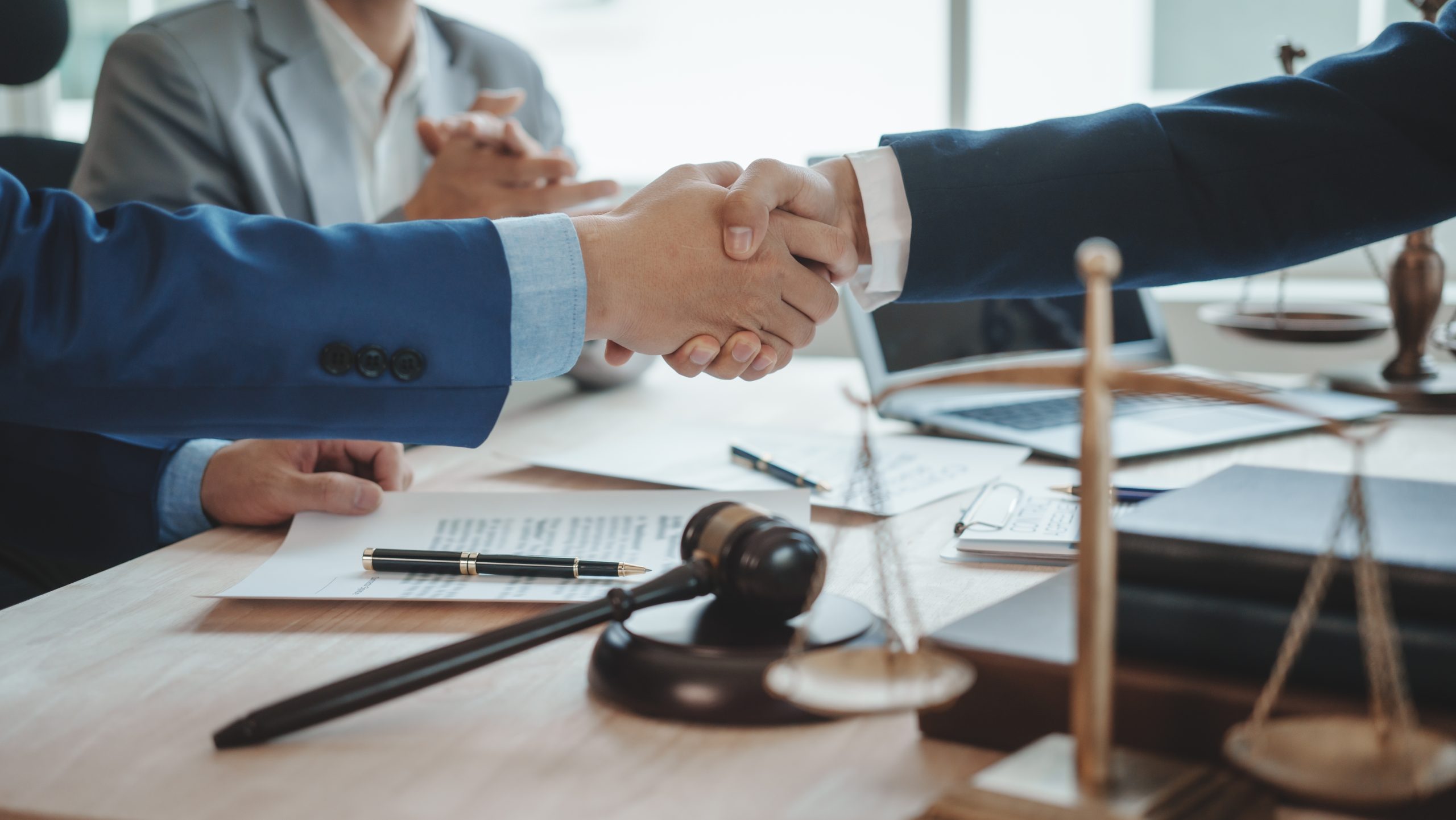 Shaking hands, Immigration lawyer houston team. Working together judge counselor having team meeting with client discussing legal legislation at law firm, Law and Legal services concept.