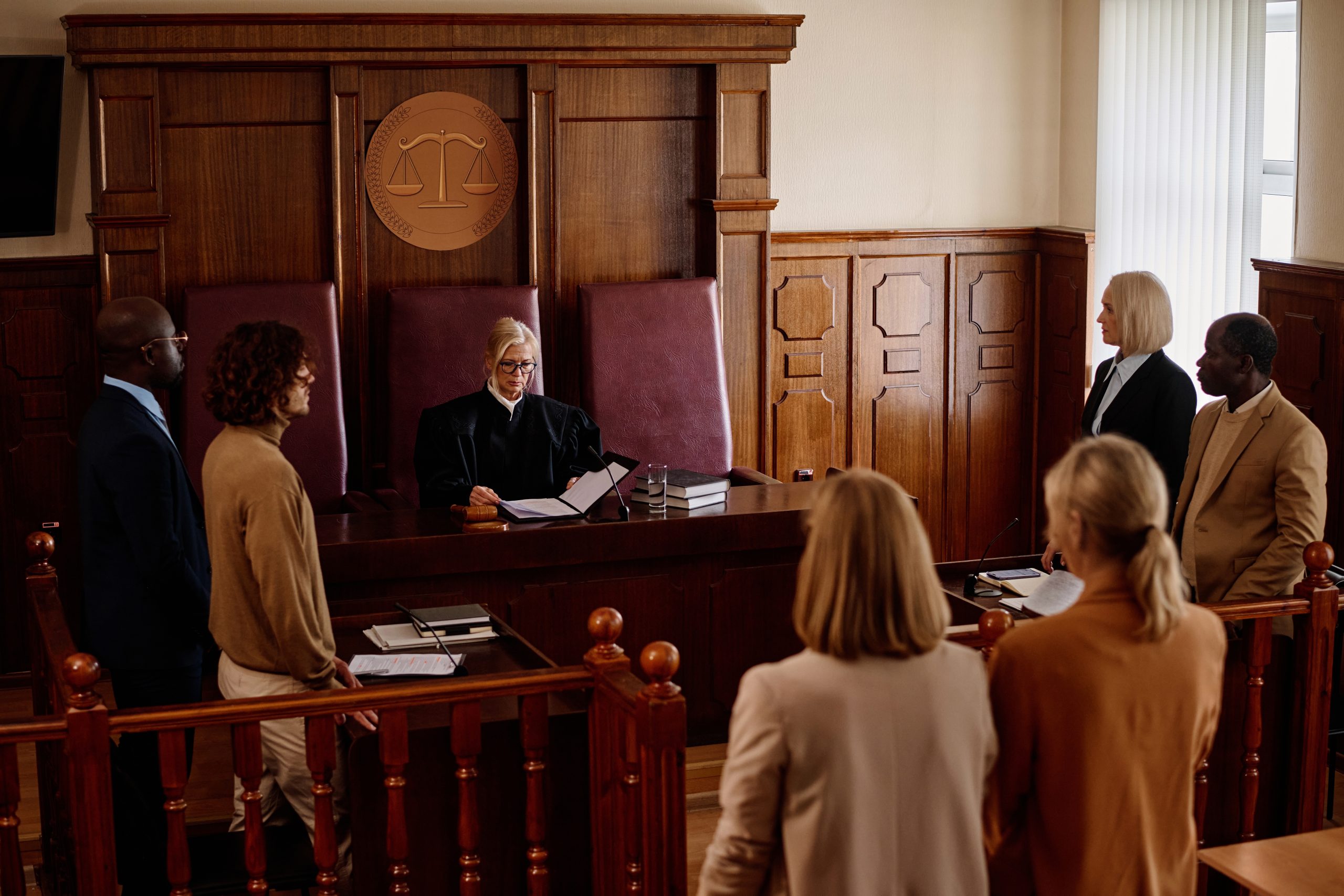 Group,Of,Witnesses,,Attorneys,,Prosecutor,And,Suspect,Standing,In,Courtroom