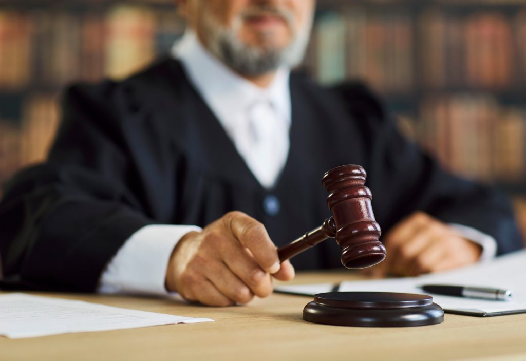 A judge and a gavel in a court in Houston. Court hearing lawyer houston